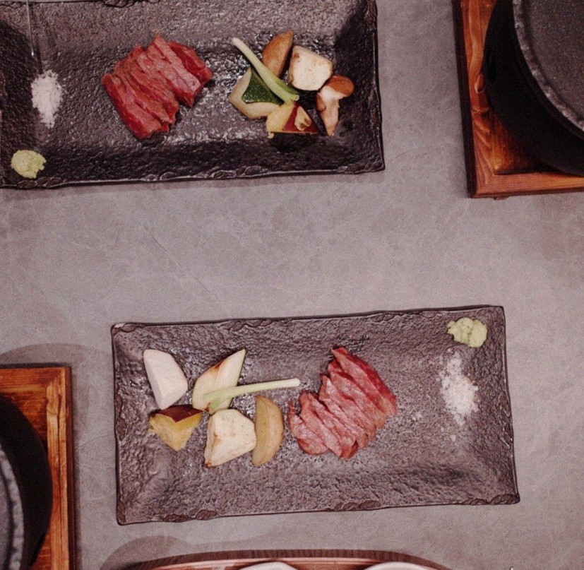 WOOHANA Jonggak · the signature Hanwoo showing — marbled beef cuts and caviar presented in a display chest