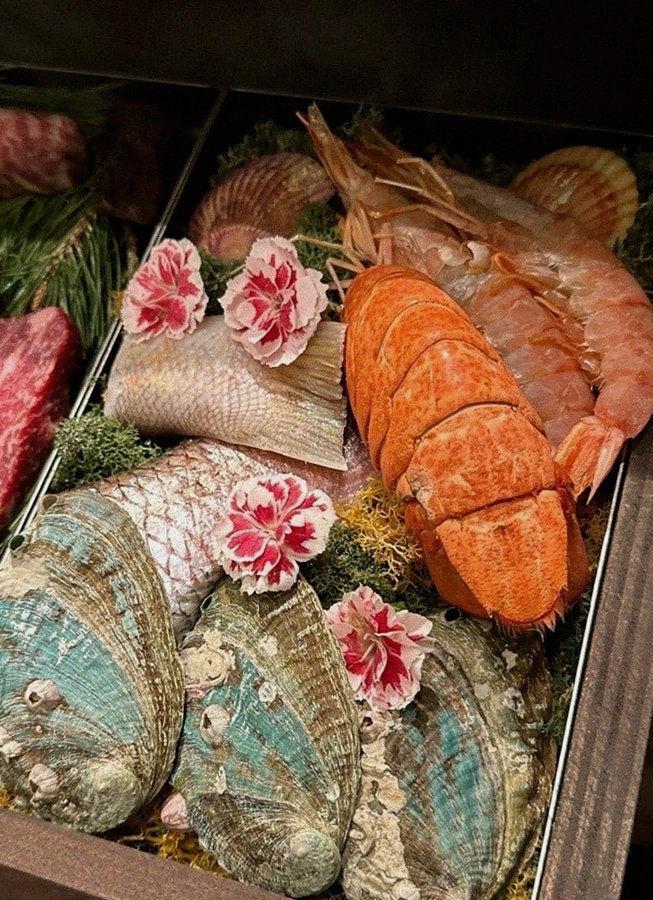 WOOHANA Jonggak · seafood course served alongside the beef