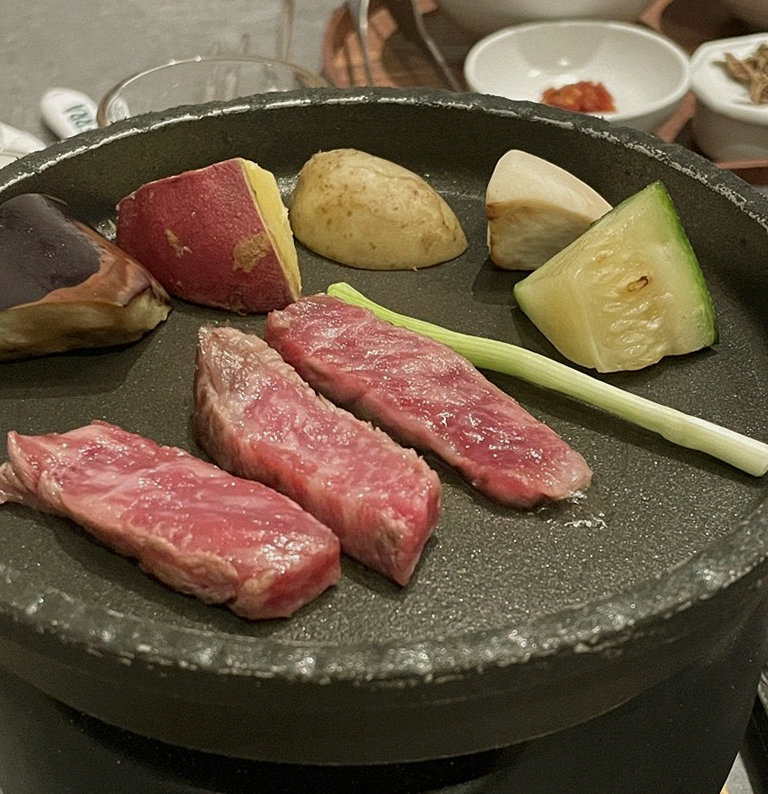 WOOHANA Jonggak · Hanwoo beef grilling over binchotan charcoal