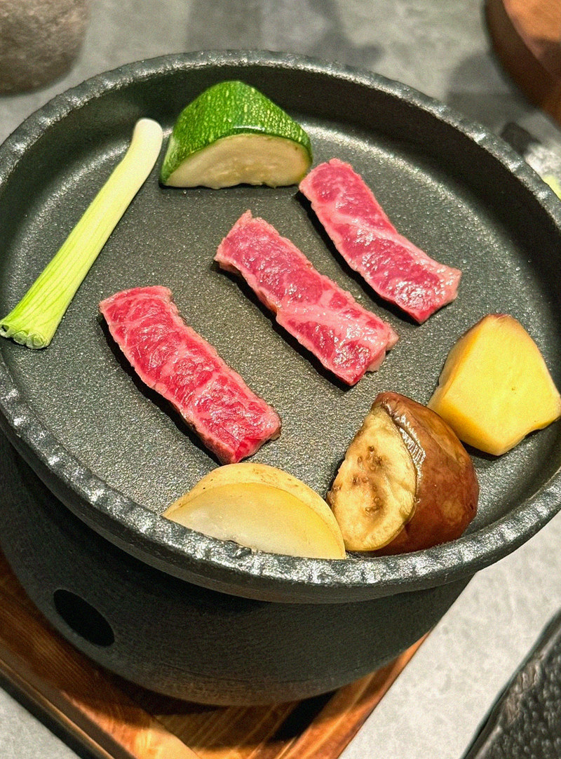WOOHANA Jonggak · the signature Hanwoo showing — marbled beef cuts and caviar presented in a display chest