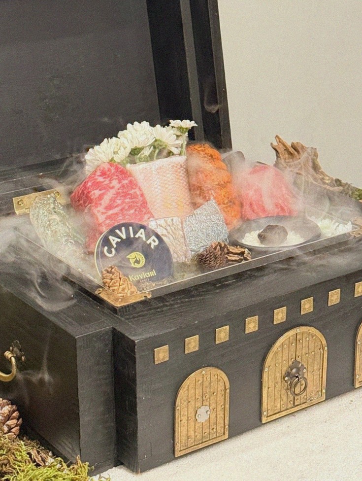 GOWOOGA Yeouido · the signature Hanwoo showing — marbled beef cuts and caviar presented in a display chest
