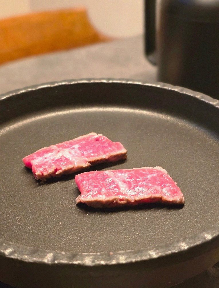 GOWOOGA Yeouido · premium marbled Hanwoo beef presented before grilling
