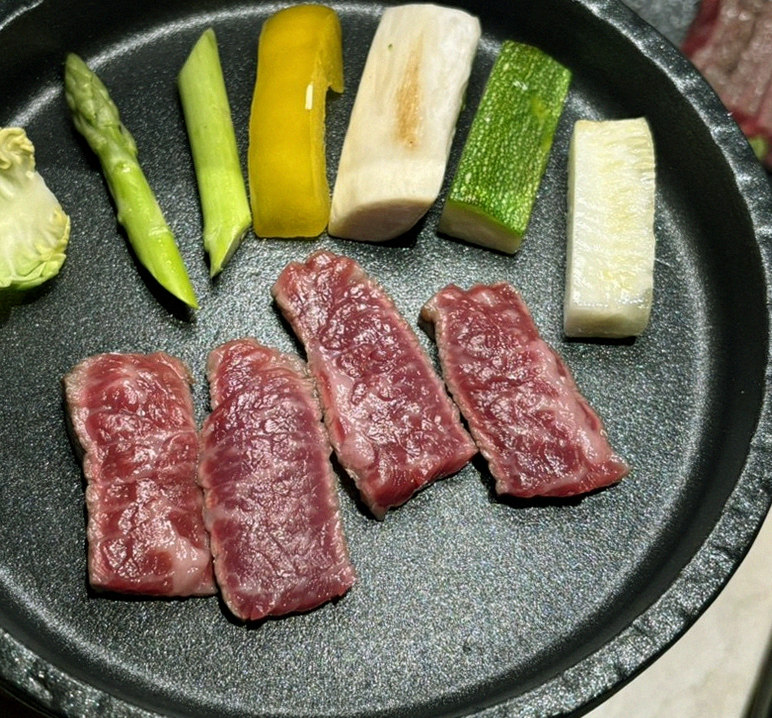 WOOARA Yeouido · premium marbled Hanwoo beef presented before grilling
