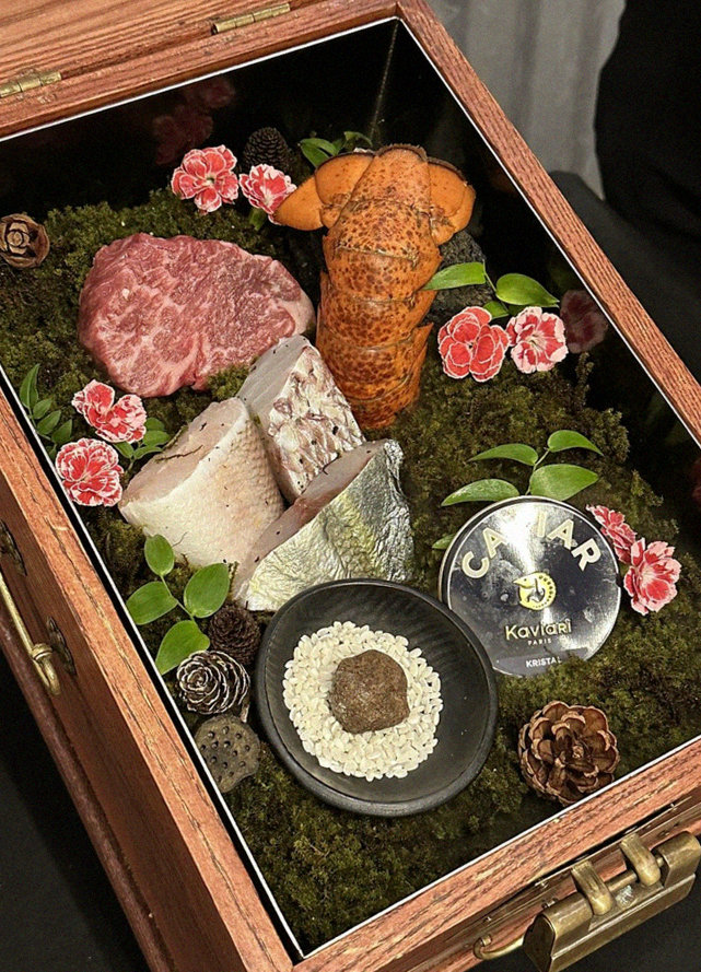 GOWOOGA Yeouido · the signature Hanwoo showing — marbled beef cuts and caviar presented in a display chest