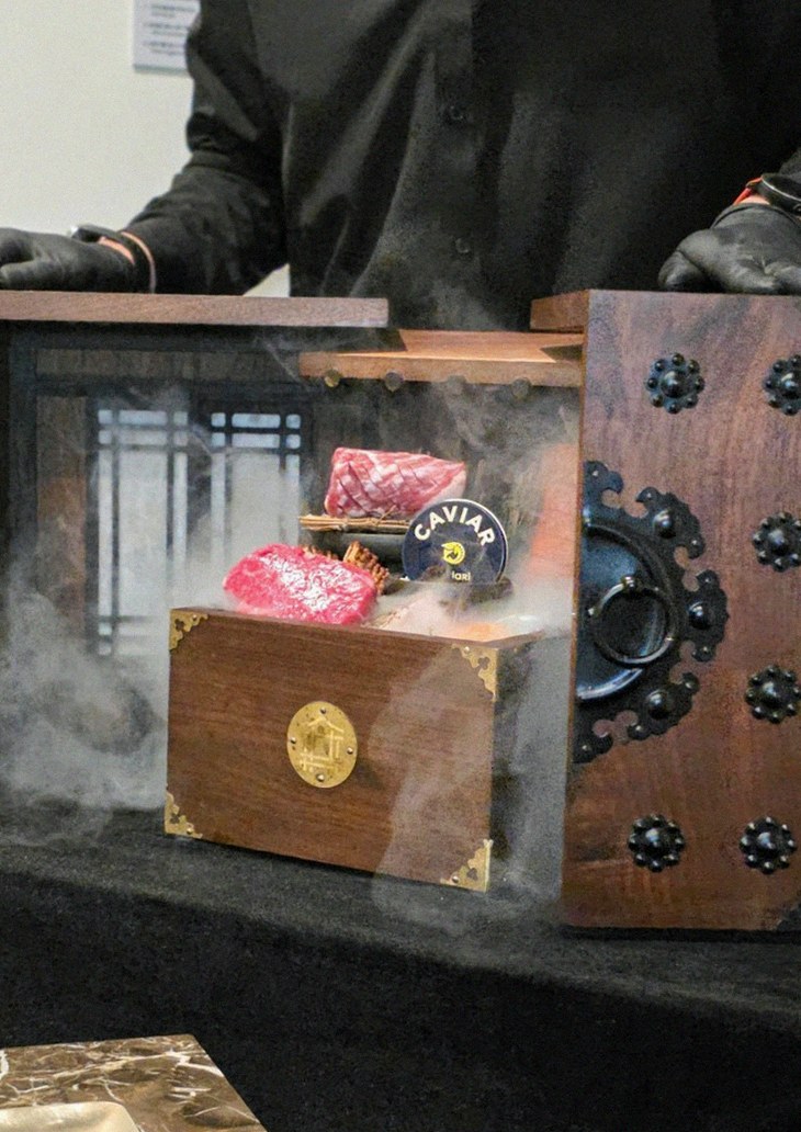 DAEBOJUNG City Hall · the signature Hanwoo showing — marbled beef cuts and caviar presented in a display chest