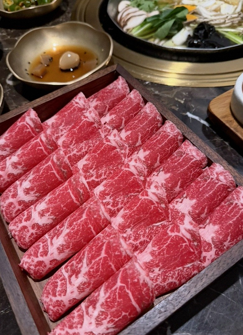 DAEBOJUNG City Hall · premium marbled Hanwoo beef presented before grilling