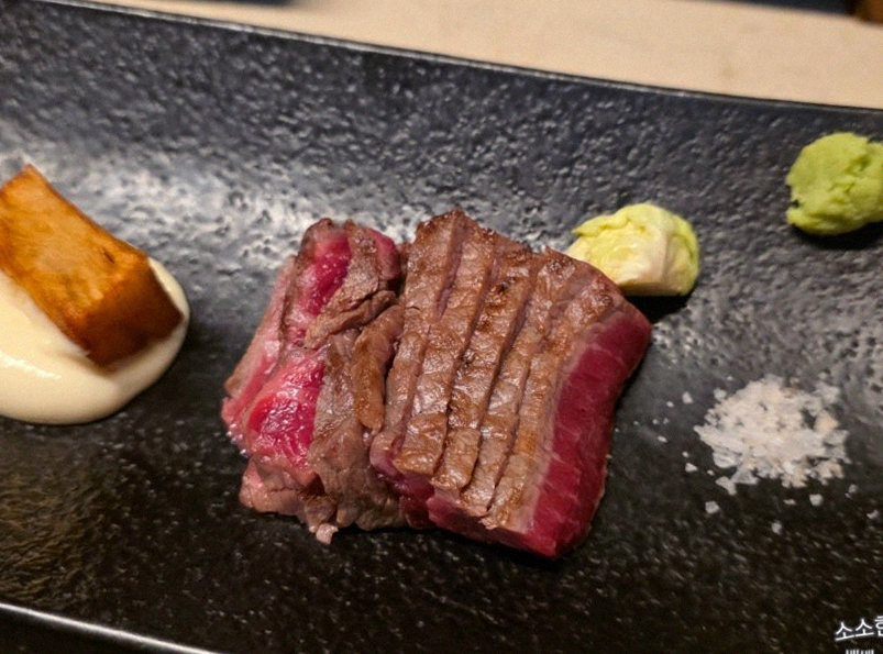 WOOARA Gwanghwamun · the signature Hanwoo showing — marbled beef cuts and caviar presented in a display chest