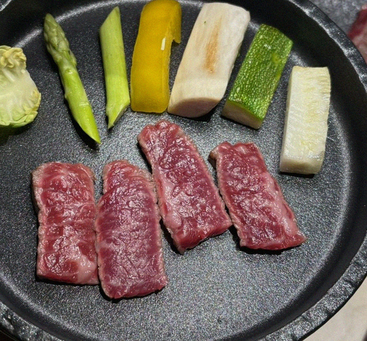 WOOARA Yeouido · premium marbled Hanwoo beef presented before grilling