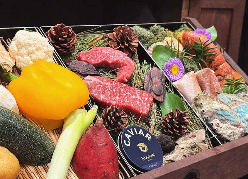 WOOHANA Jonggak · the signature Hanwoo showing — marbled beef cuts and caviar presented in a display chest
