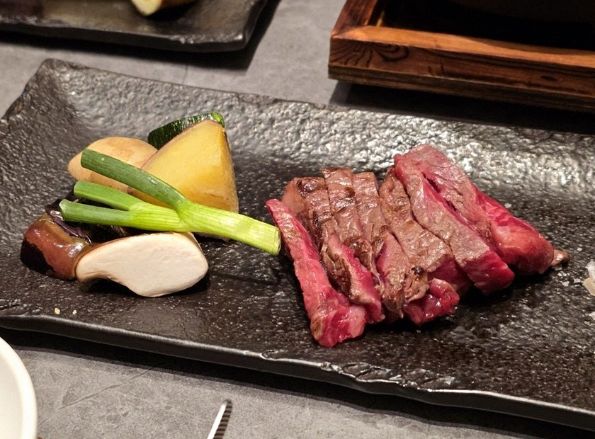 WOOHANA Yeouido · the signature Hanwoo showing — marbled beef cuts and caviar presented in a display chest