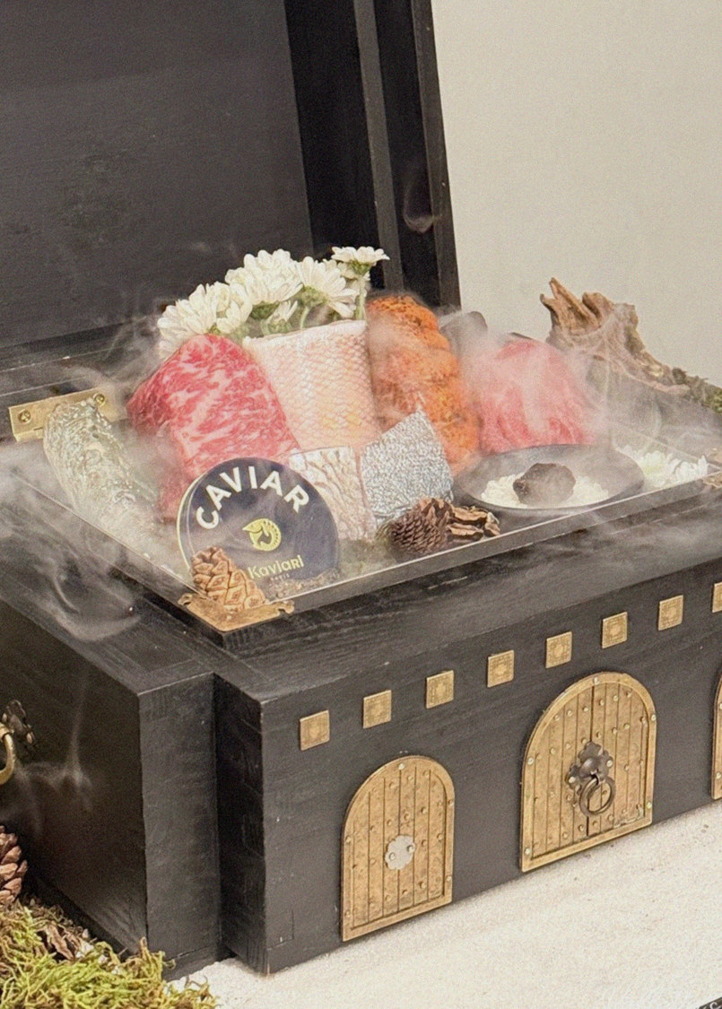 GOWOOGA Yeouido · the signature Hanwoo showing — marbled beef cuts and caviar presented in a display chest