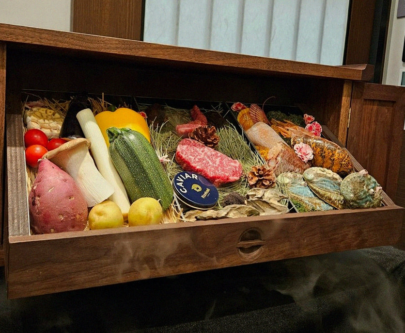 WOOHANA Yeouido · the signature Hanwoo showing — marbled beef cuts and caviar presented in a display chest