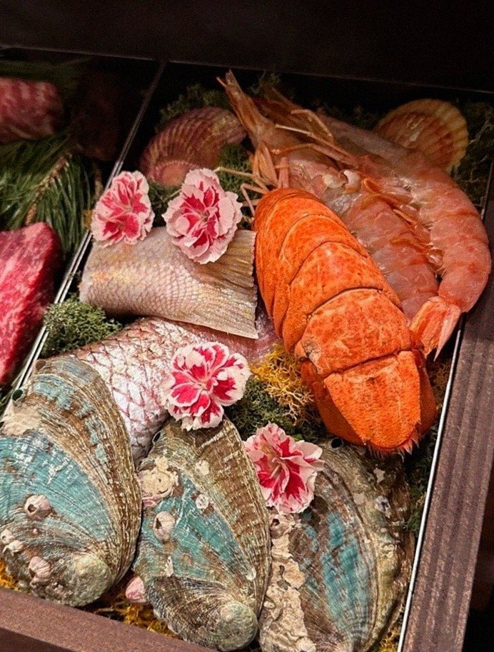 WOOHANA Yeouido · seafood course served alongside the beef