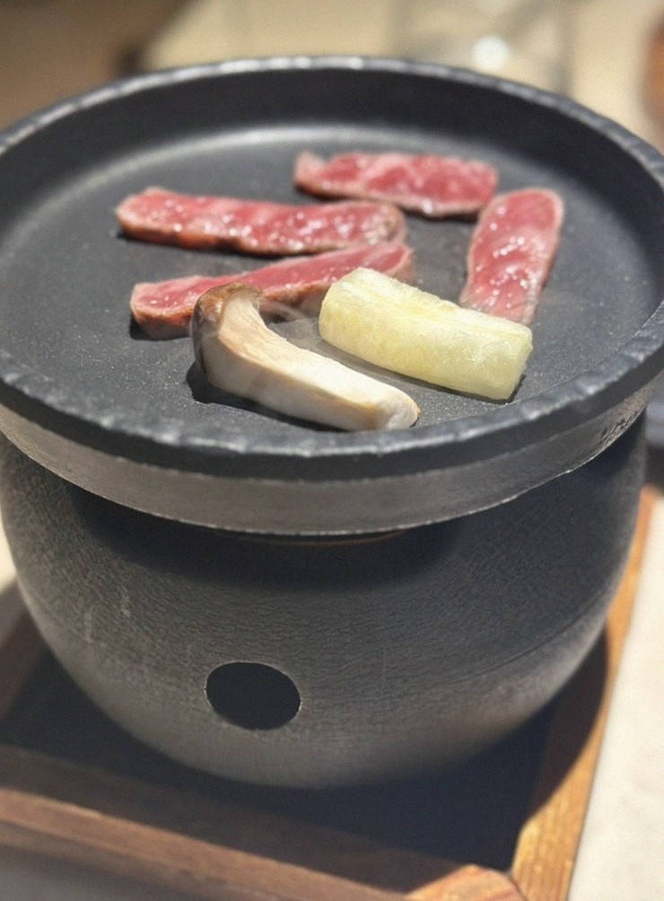 WOOARA Yeouido · the signature Hanwoo showing — marbled beef cuts and caviar presented in a display chest
