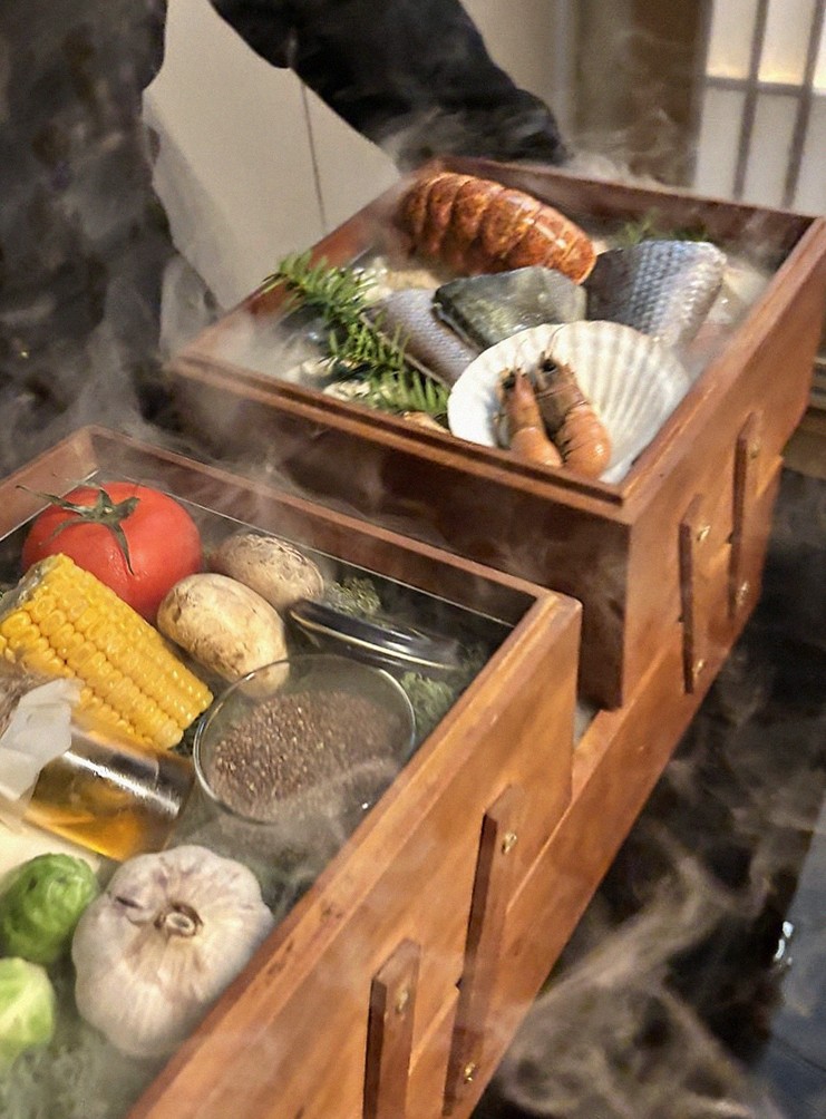 WOOARA Yeouido · the signature Hanwoo showing — marbled beef cuts and caviar presented in a display chest