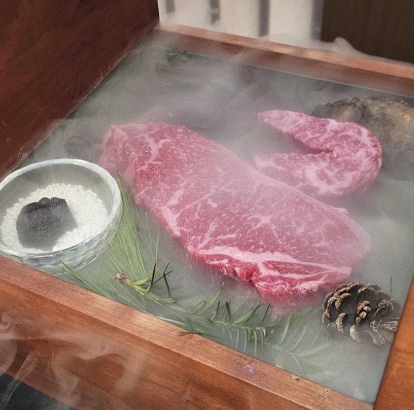 WOOARA Yeouido · the signature Hanwoo showing — marbled beef cuts and caviar presented in a display chest