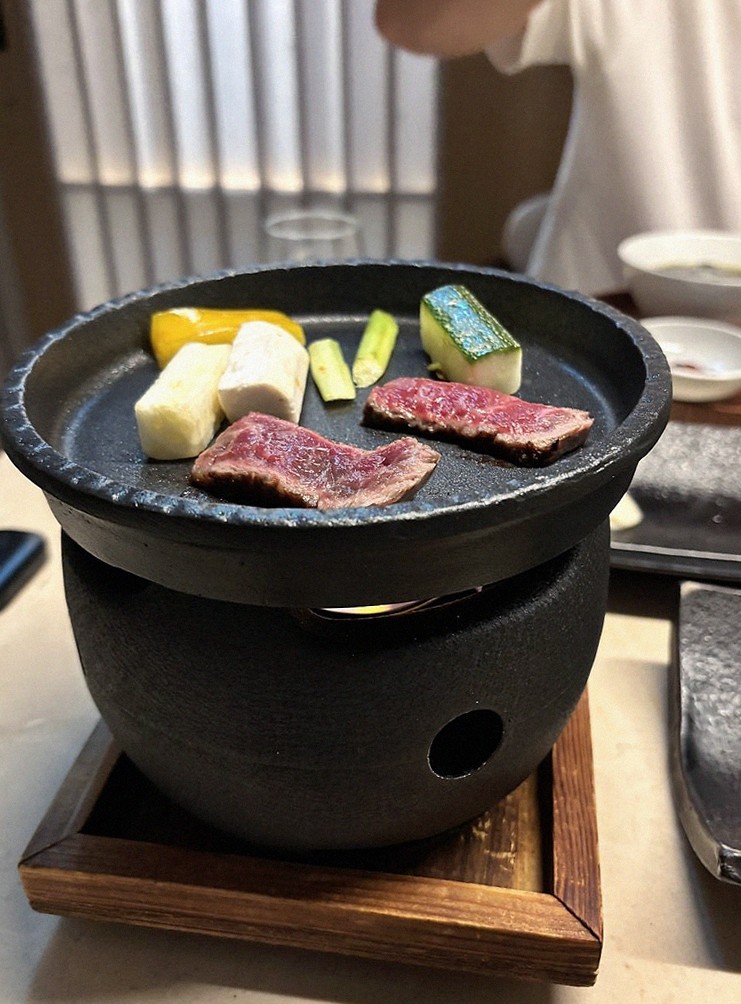WOOARA Yeouido · the signature Hanwoo showing — marbled beef cuts and caviar presented in a display chest