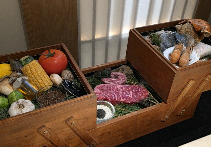 WOOARA Gwanghwamun · the signature Hanwoo showing — marbled beef cuts and caviar presented in a display chest
