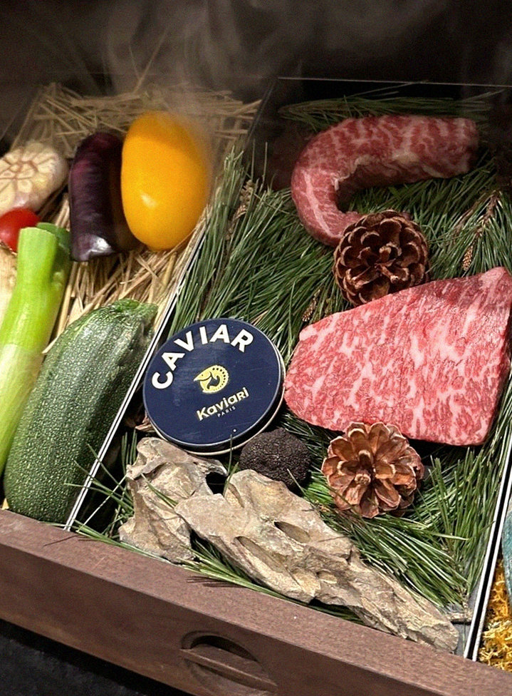 WOOHANA Yeouido · the signature Hanwoo showing — marbled beef cuts and caviar presented in a display chest