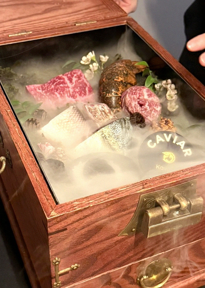 GOWOOGA Yeouido · the signature Hanwoo showing — marbled beef cuts and caviar presented in a display chest