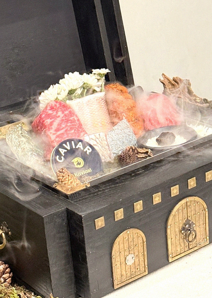 GOWOOGA Yeouido · the signature Hanwoo showing — marbled beef cuts and caviar presented in a display chest