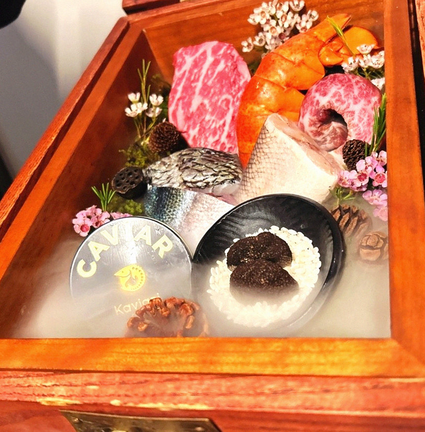 GOWOOGA Yeouido · the signature Hanwoo showing — marbled beef cuts and caviar presented in a display chest