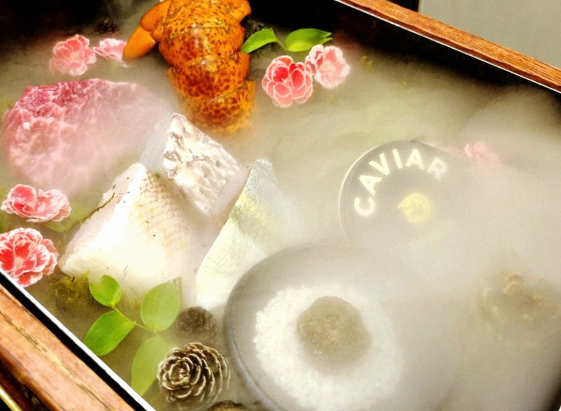 GOWOOGA Yeouido · the signature Hanwoo showing — marbled beef cuts and caviar presented in a display chest