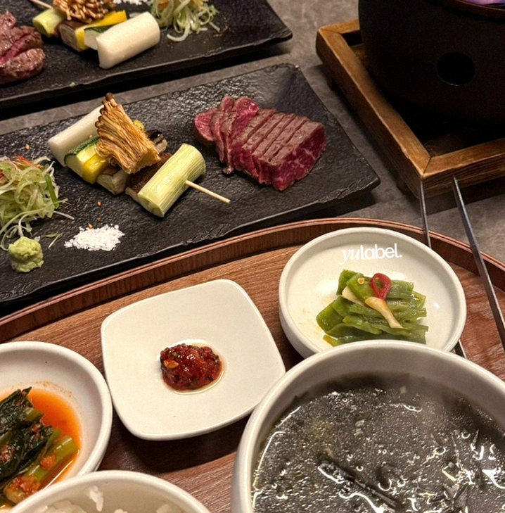 GOWOOGA Yeouido · the signature Hanwoo showing — marbled beef cuts and caviar presented in a display chest