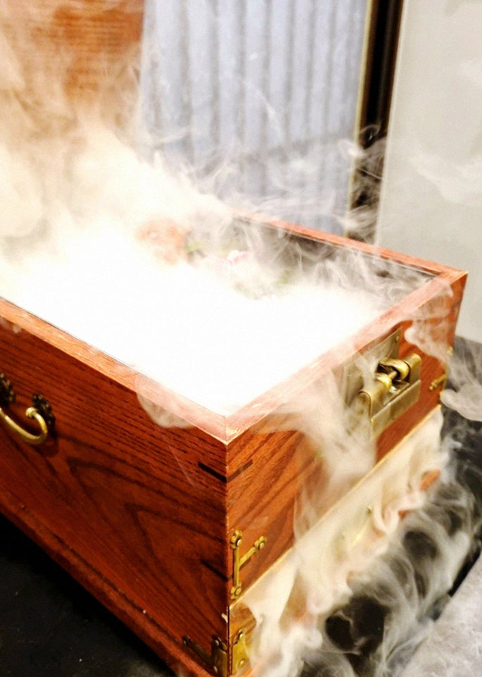 GOWOOGA Yeouido · the signature Hanwoo showing — marbled beef cuts and caviar presented in a display chest