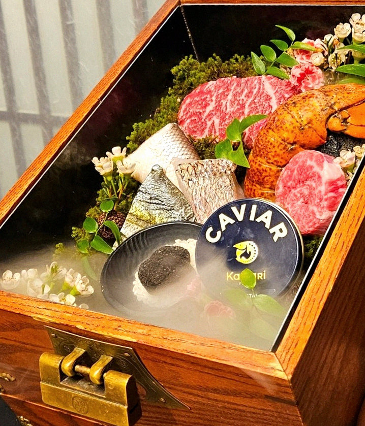 GOWOOGA Yeouido · the signature Hanwoo showing — marbled beef cuts and caviar presented in a display chest