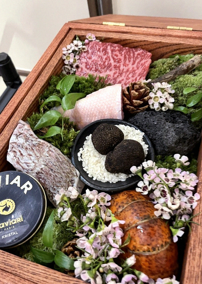 GOWOOGA Yeouido · the signature Hanwoo showing — marbled beef cuts and caviar presented in a display chest