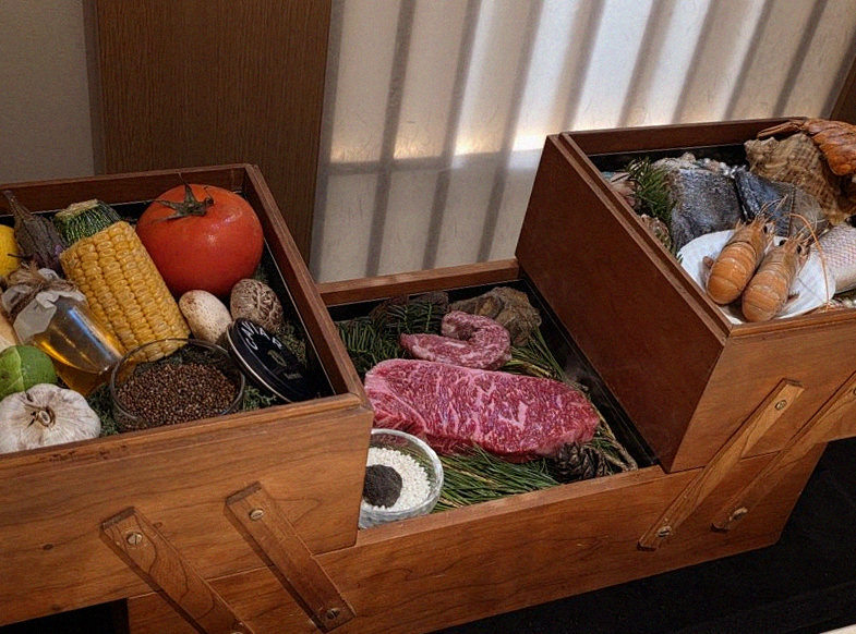 WOOARA Gwanghwamun · the signature Hanwoo showing — marbled beef cuts and caviar presented in a display chest