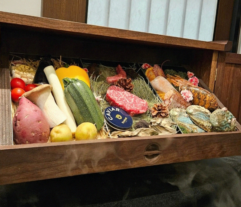 WOOHANA Jonggak · the signature Hanwoo showing — marbled beef cuts and caviar presented in a display chest