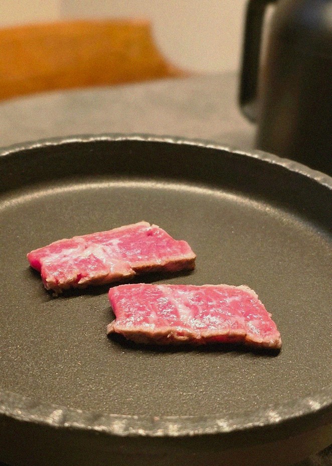 GOWOOGA Yeouido · premium marbled Hanwoo beef presented before grilling