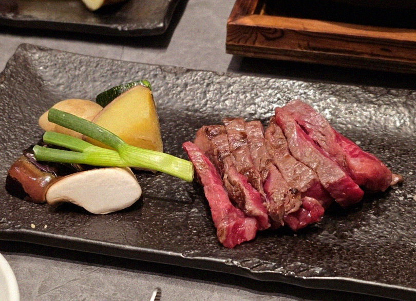 WOOHANA Jonggak · the signature Hanwoo showing — marbled beef cuts and caviar presented in a display chest