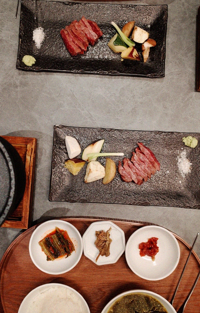 WOOHANA Jonggak · the signature Hanwoo showing — marbled beef cuts and caviar presented in a display chest