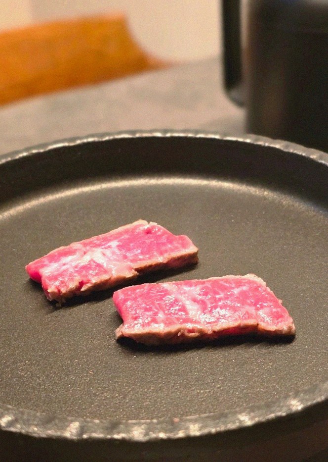 GOWOOGA Yeouido · premium marbled Hanwoo beef presented before grilling