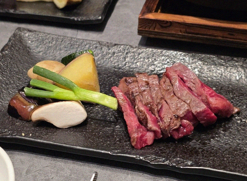 WOOHANA Yeouido · the signature Hanwoo showing — marbled beef cuts and caviar presented in a display chest