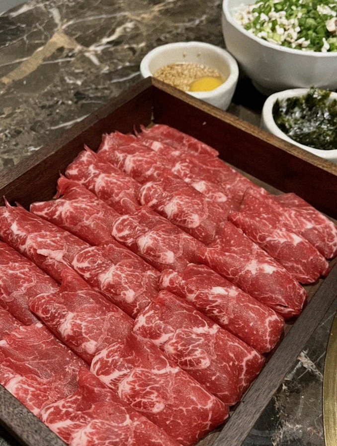 DAEBOJUNG City Hall · premium marbled Hanwoo beef presented before grilling