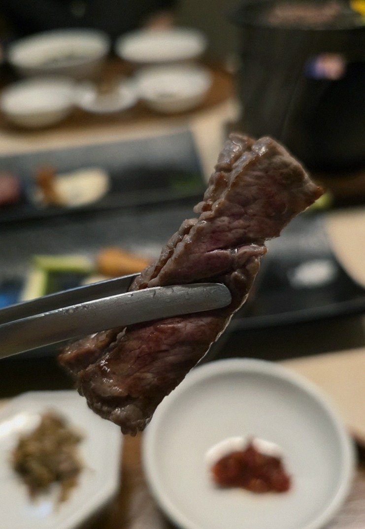 WOOARA Yeouido · premium marbled Hanwoo beef presented before grilling