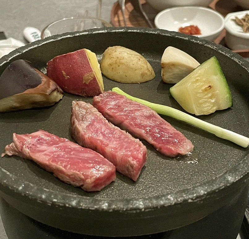 WOOHANA Jonggak · Hanwoo beef grilling over binchotan charcoal