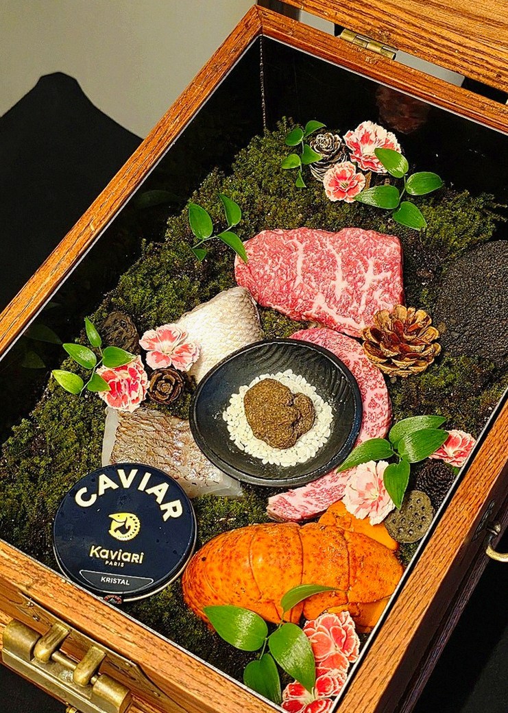 GOWOOGA Yeouido · the signature Hanwoo showing — marbled beef cuts and caviar presented in a display chest