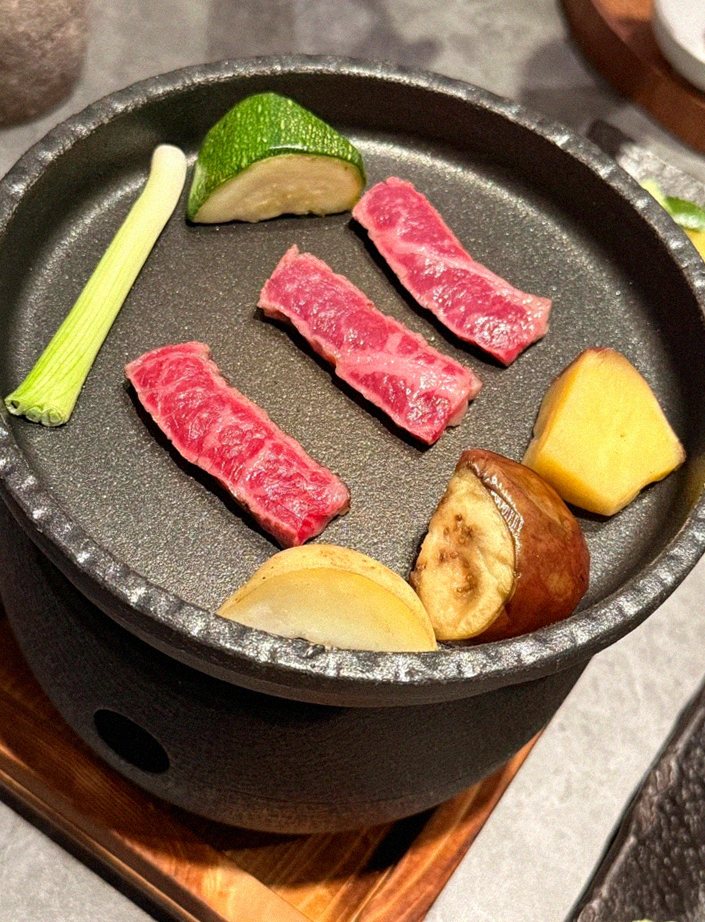 WOOHANA Yeouido · the signature Hanwoo showing — marbled beef cuts and caviar presented in a display chest
