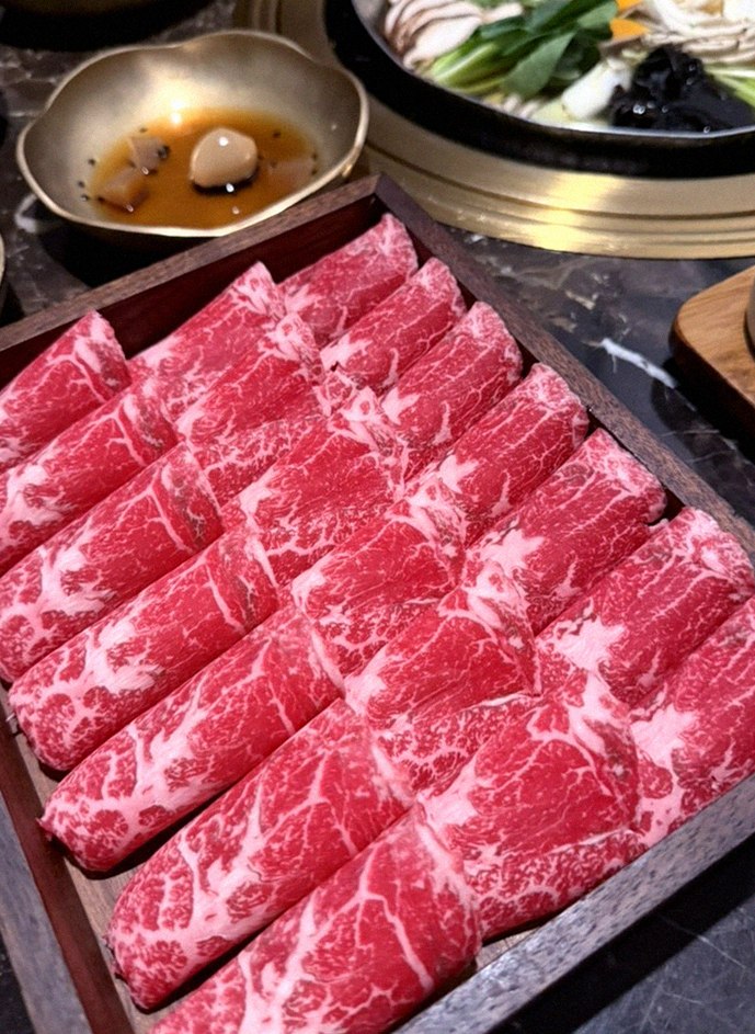 DAEBOJUNG City Hall · premium marbled Hanwoo beef presented before grilling