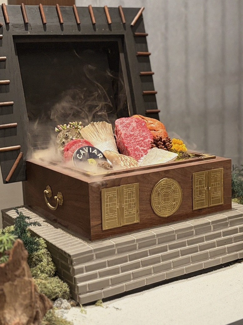 GOWOOGA Gangnam·Yeoksam · the signature Hanwoo showing — marbled beef cuts and caviar presented in a display chest