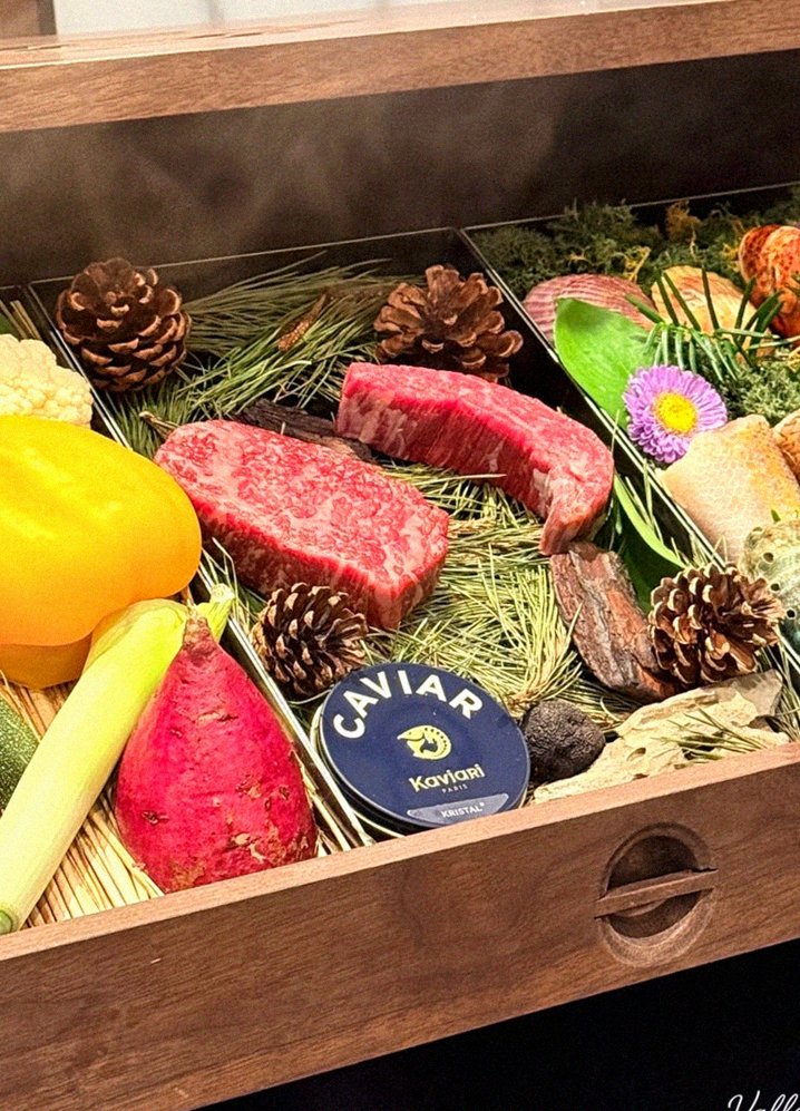 WOOHANA Jonggak · the signature Hanwoo showing — marbled beef cuts and caviar presented in a display chest