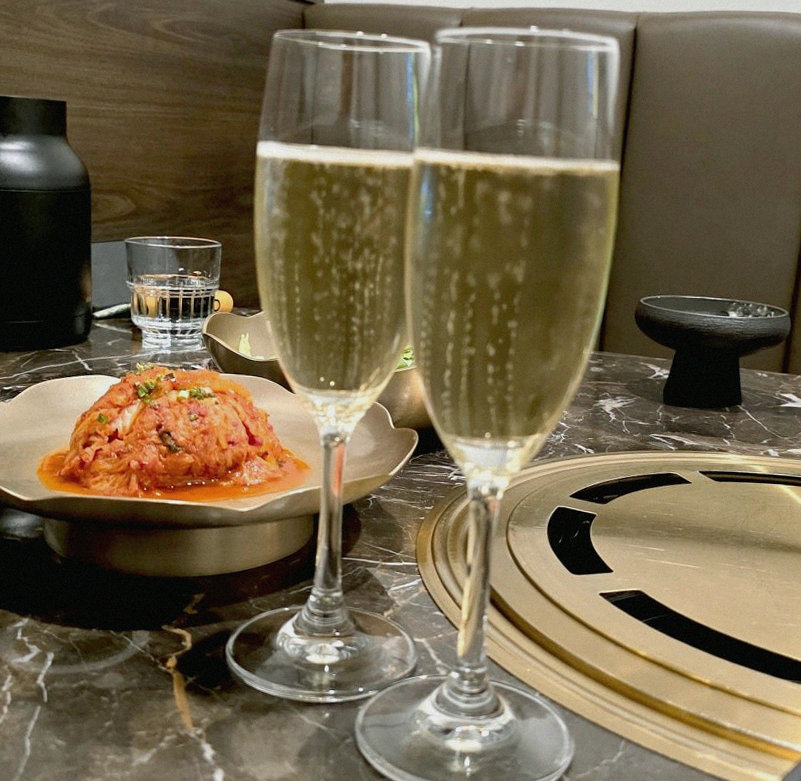 DAEBOJUNG City Hall · the signature Hanwoo showing — marbled beef cuts and caviar presented in a display chest