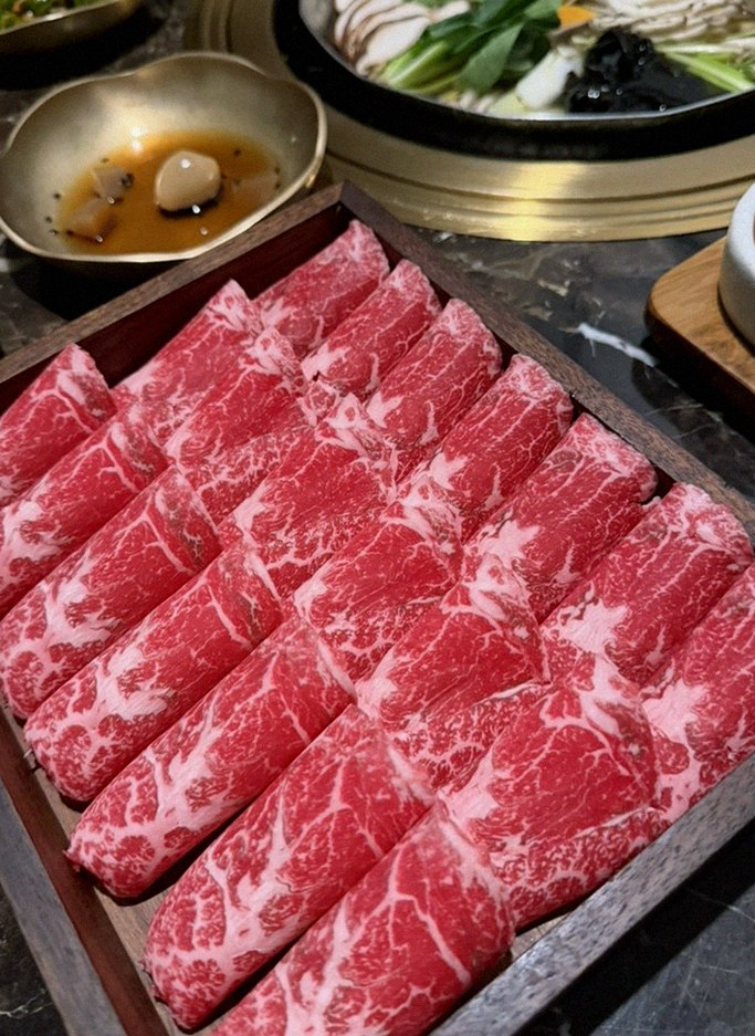 DAEBOJUNG City Hall · premium marbled Hanwoo beef presented before grilling