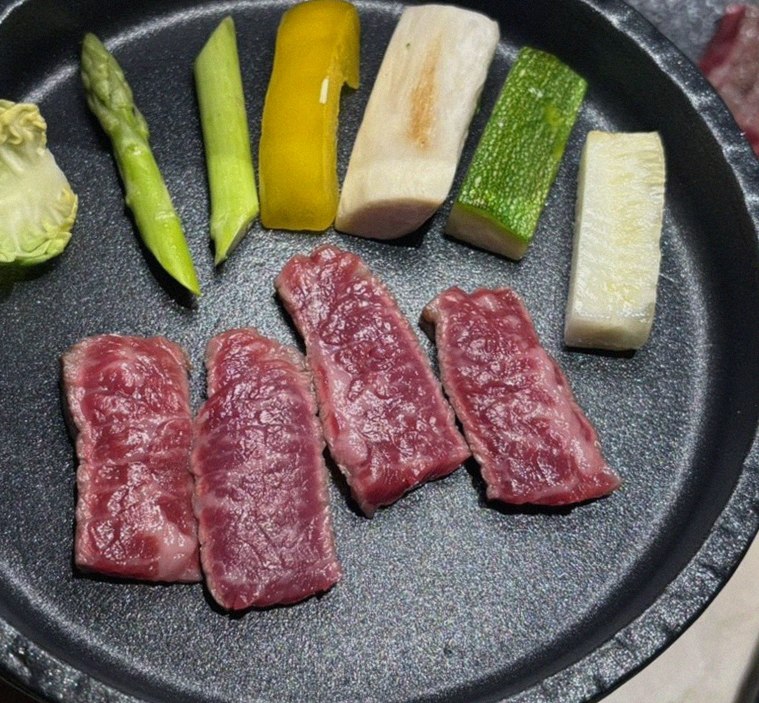 WOOARA Yeouido · premium marbled Hanwoo beef presented before grilling