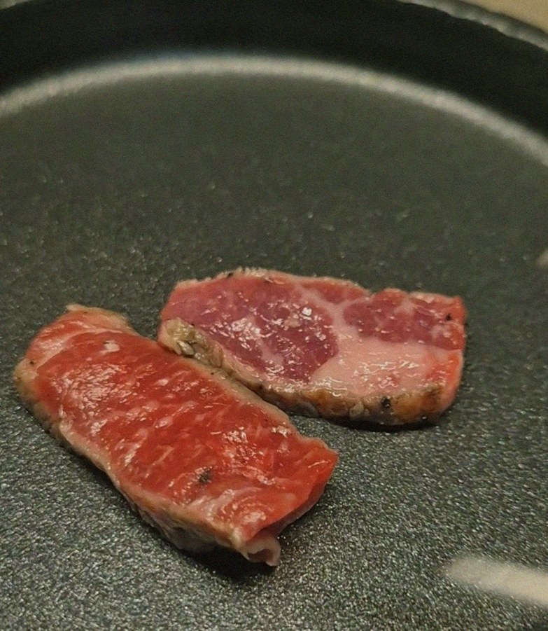 WOOARA Gwanghwamun · premium marbled Hanwoo beef presented before grilling